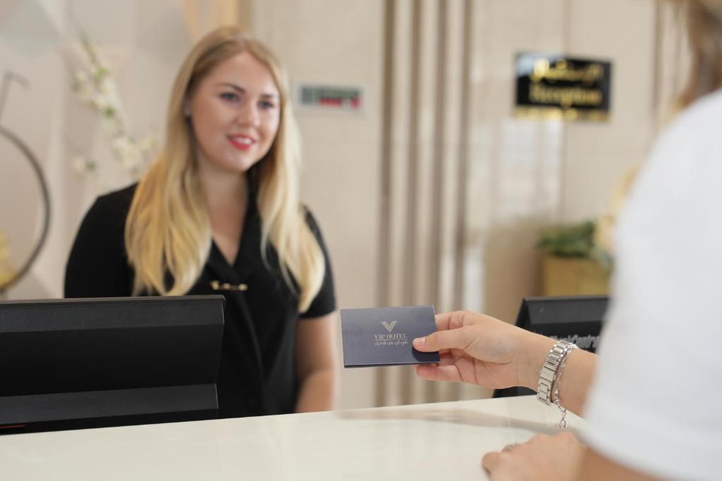 Vip Hotel Doha Qatar Exterior photo A hotel receptionist